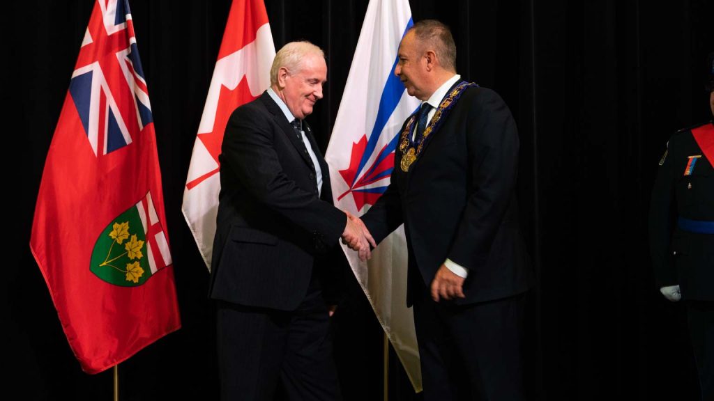 CEO of Sterling Industries, David Van Slingerland, is accepting his award from Mayor Maurizio Bevilacqua at the investiture ceremony at Vaughan City Hall.