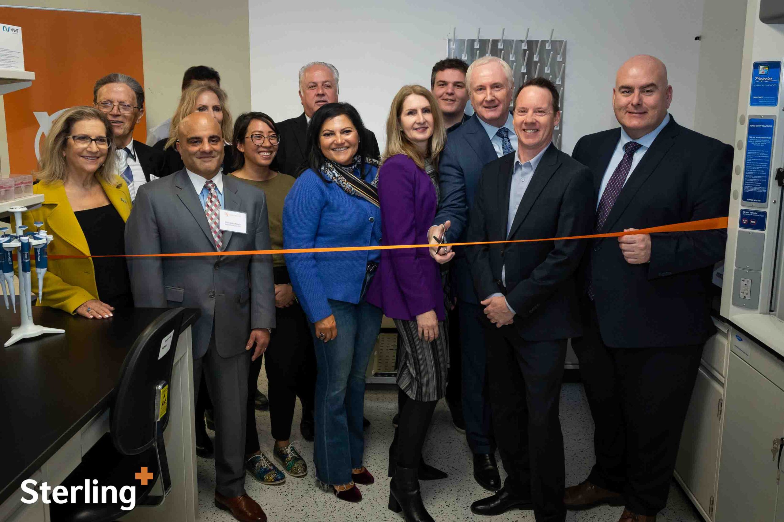 Matt Skynner, David Van Slingerland, and Laura Smith, MPP, are cutting the ribbon for the Medtech Innovation Lab at Sterling Industries.